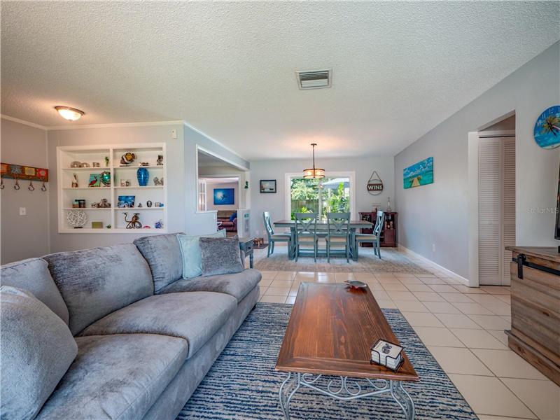 Living room with view of dining room