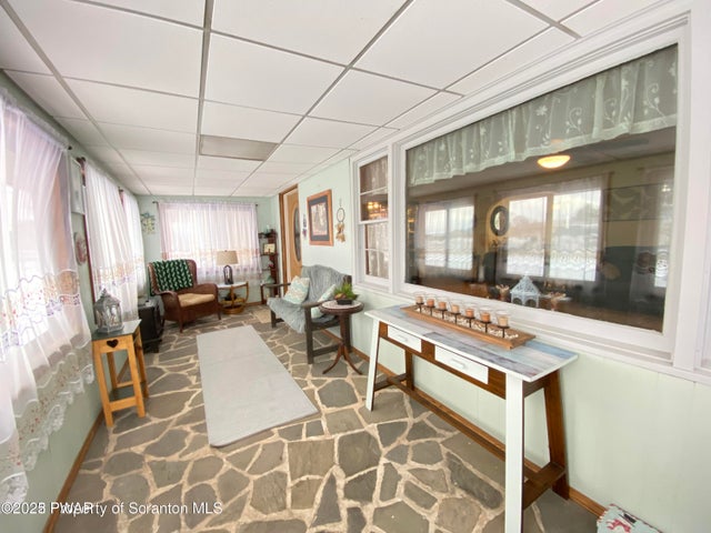 3-Season Sun room or mud room is an added bonus