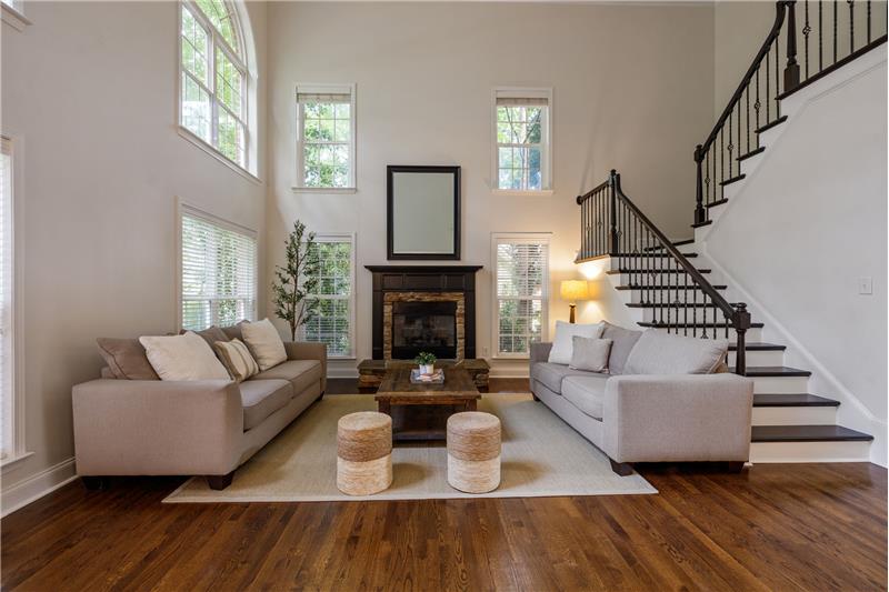 Great room's focal point is the dramatic gas log fireplace/mantel