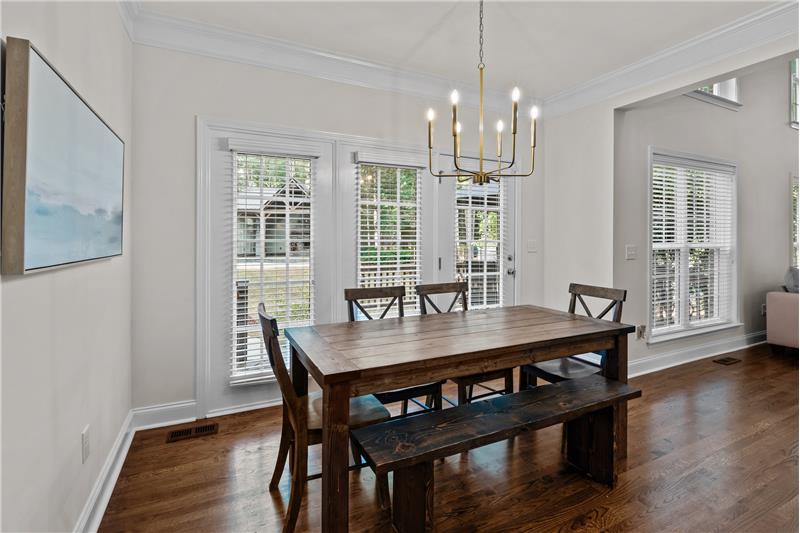 Bright, sunny breakfast area adjacent to kitchen ideal for daily meals, casual entertaining