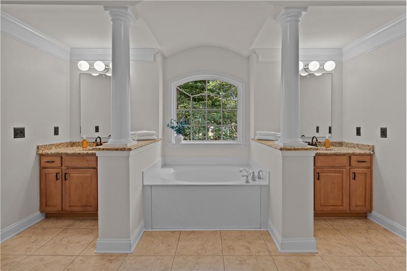 Primary bathroom: his & her vanities with granite, whirlpool tub, step-in shower, private WC, tile flooring