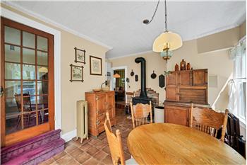 eat in area showing wood burning stove