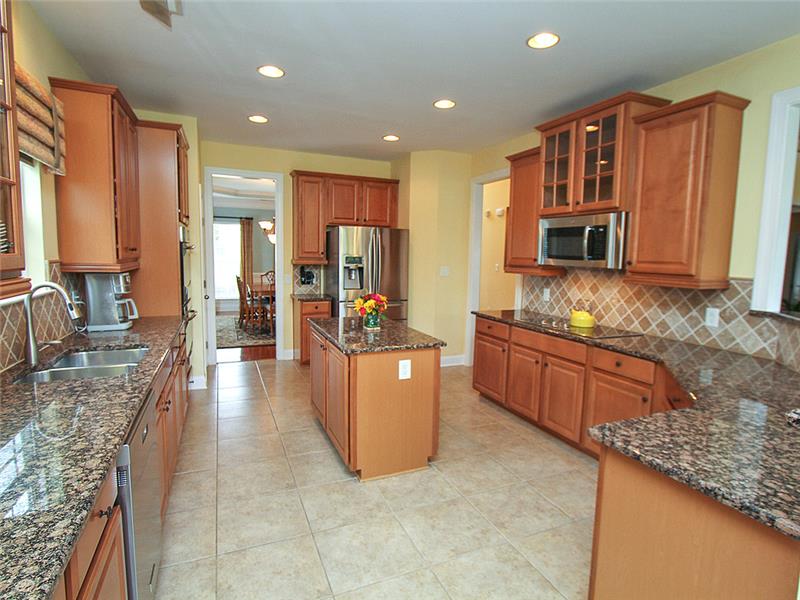Granite counter tops, tile backsplash and floor