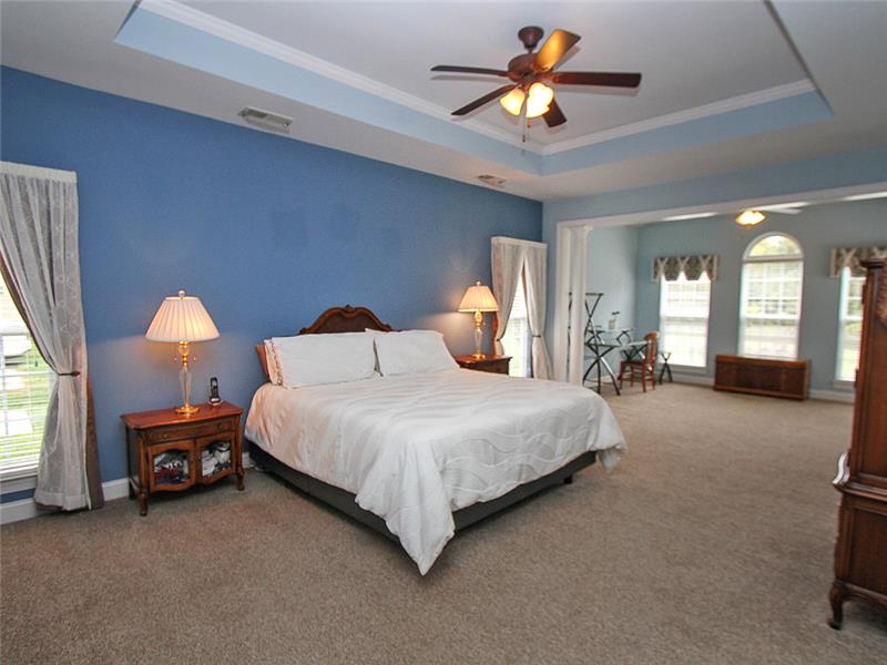 Primary bedroom suite has sitting area