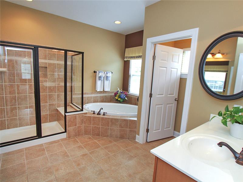 Primary bathroom with his and hers vanities