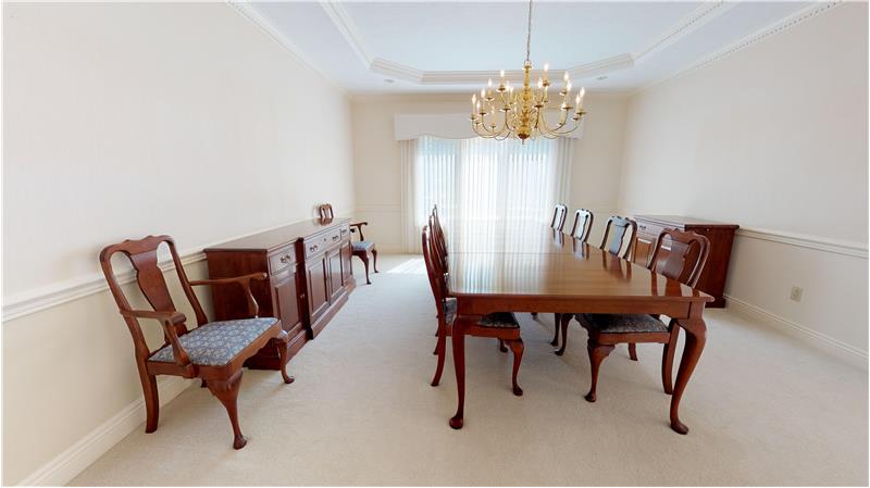 Easily accommodate 10-12 guests in this lovely formal dining room!