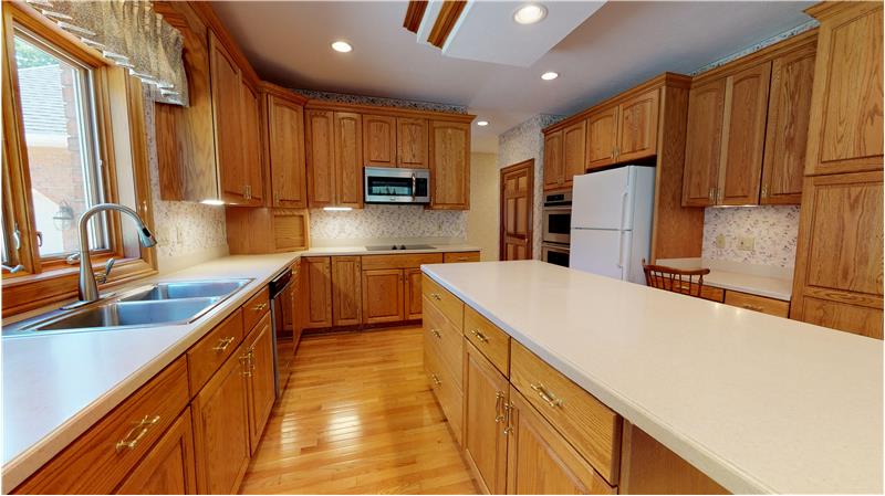 Wonderful kitchen with center island, hardwood floors, double ovens, and all appliances included!