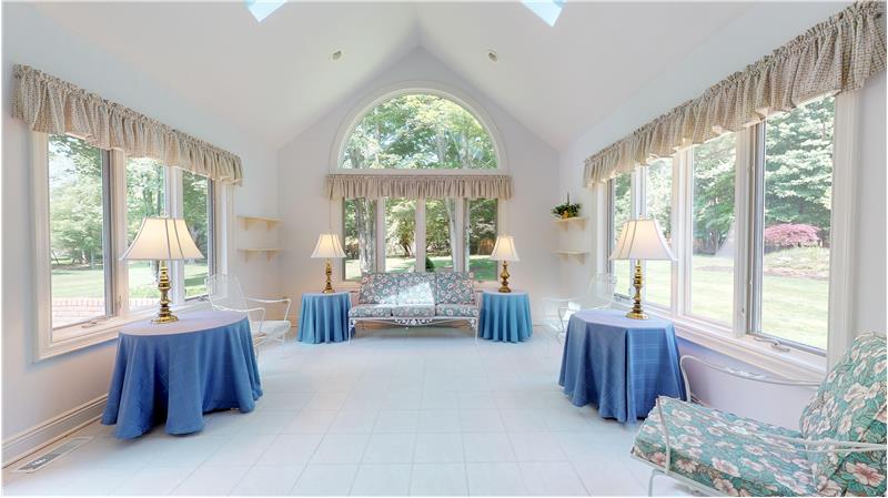 Relax or entertain in this natural light filled 4 season sun room! Ceramic tiled floor and access to the patio!