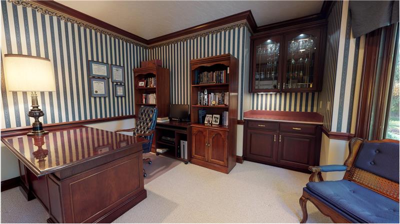 Handsome library with beautiful built ins.