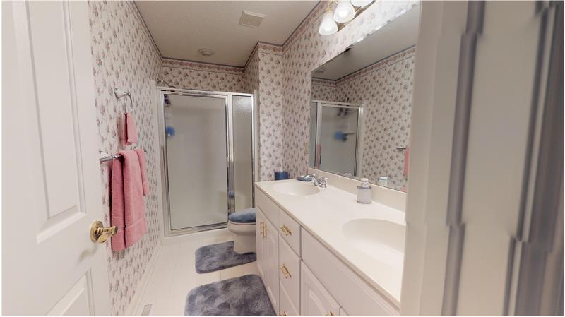 Full bath adjacent to bedroom number 2 with ceramic tiled floor!