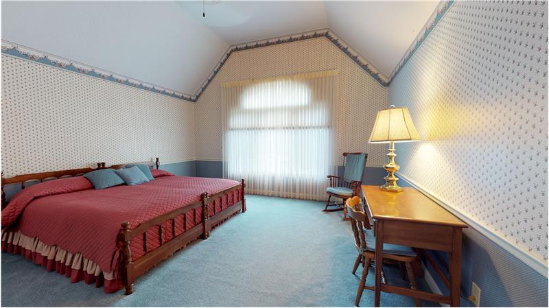 Bedroom 4 on the second floor withe vaulted ceiling and large walk in closet!