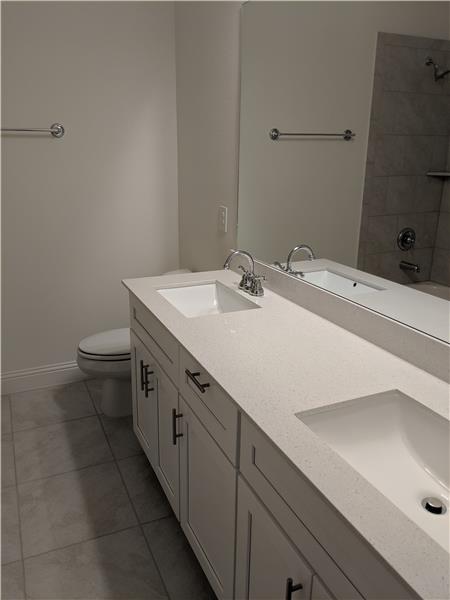 Dual vanities in the secondary bathroom