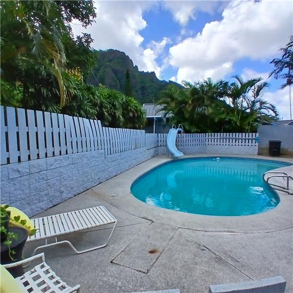 Heated pool fenced in from the rest of the yard