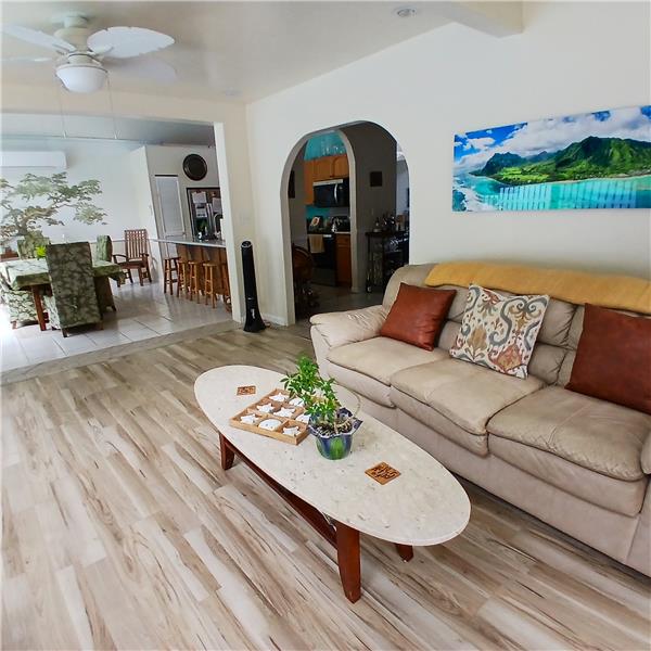 Living room with dining area in background