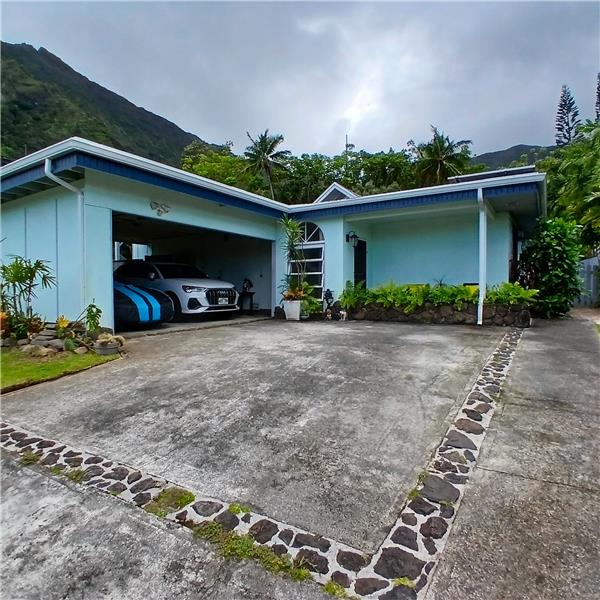 2-car carport with additional secure storage spaces and washer and dryer