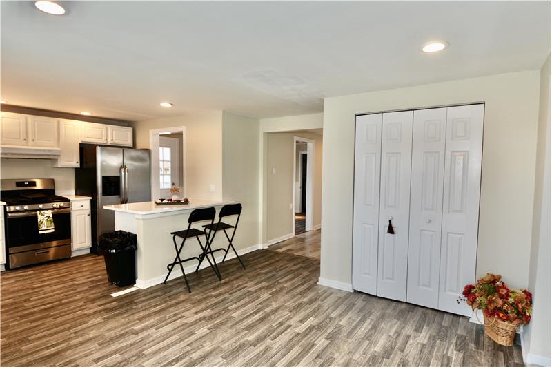 View into foyer and kitchen from front door