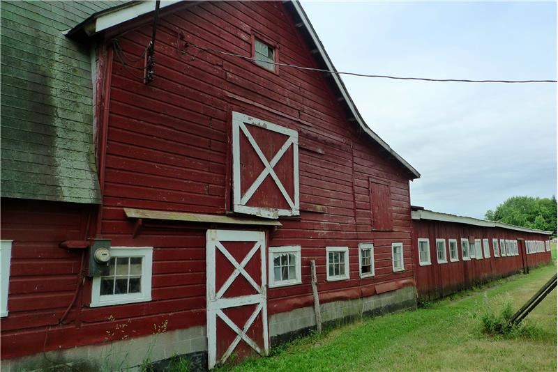 Barn with attached milking parlor