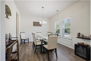 Formal Dining - New LVP flooring through main level, stairs, and upper landing