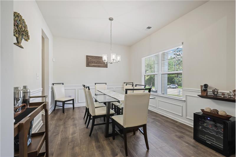 Formal Dining - New LVP flooring through main level, stairs, and upper landing