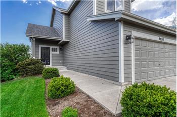 Beautifully landscaped with mature trees and shrubs.
