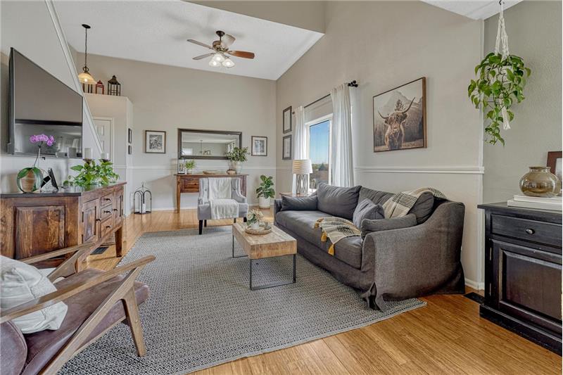 The Living Room also has chair railing and a lighted ceiling fan.