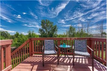 Backyard deck for outdoor dining and relaxation.