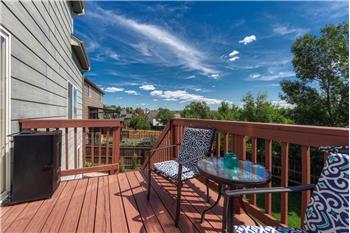 The backyard deck has stairs to the backyard.