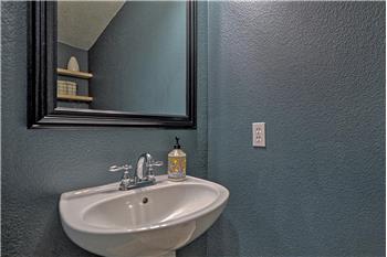 Convenient Powder Bathroom located off the Kitchen.