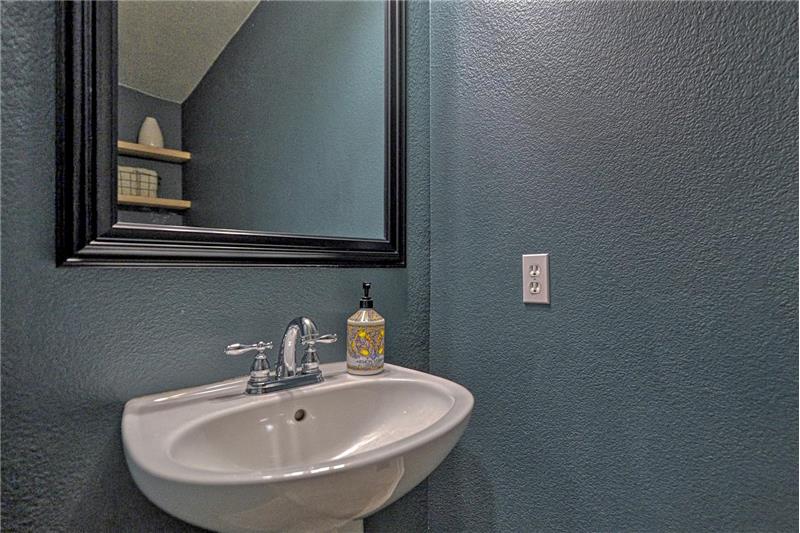 Convenient Powder Bathroom located off the Kitchen.