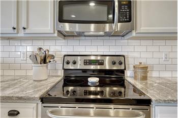 Smooth top range oven and built-in microwave oven.