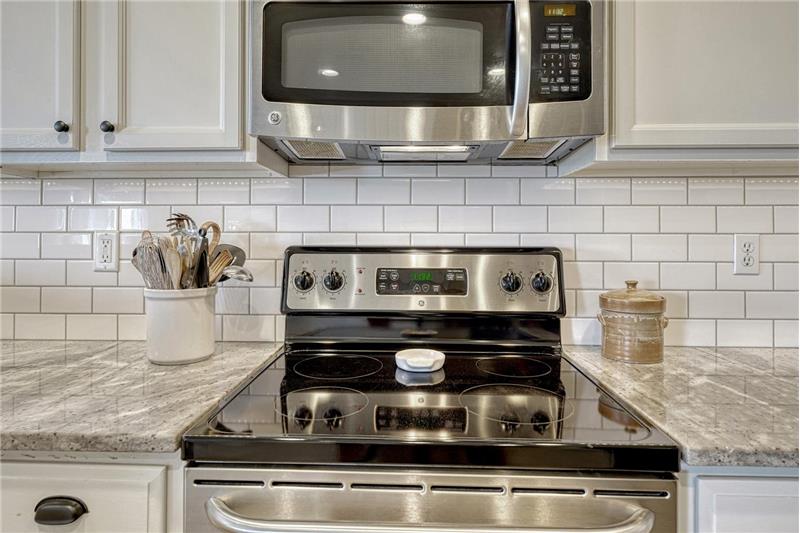 Smooth top range oven and built-in microwave oven.