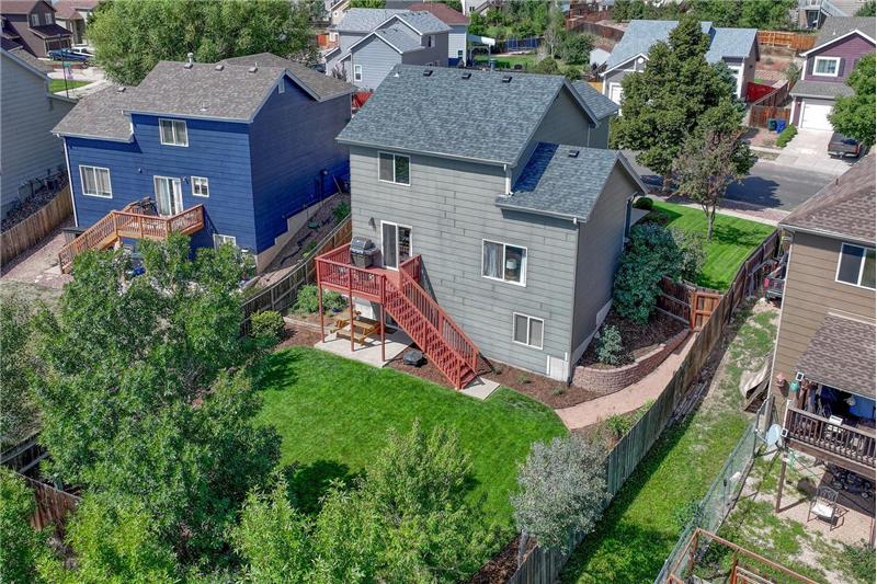 Aerial rear view of home and backyard.