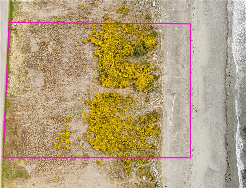Property Lines in this photo are approximate. North and Sound Markers are visible on site.