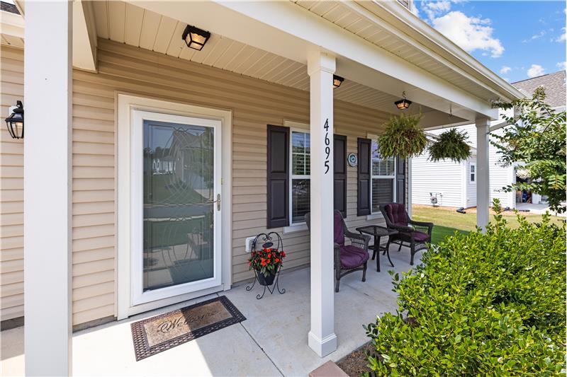 Rocking chair front porch; covered entrance.