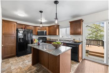 Breakfast Bar in the kitchen island with updated lighting above