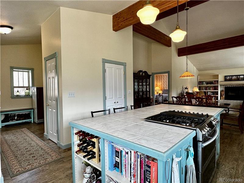 Kitchen showing 5-burner propane range with double oven