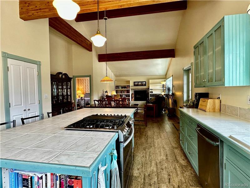 Long view of kitchen, dining room and living room