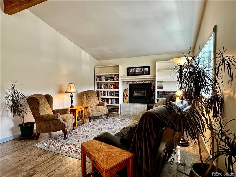 Note built-in bookshelves on each side of fireplace