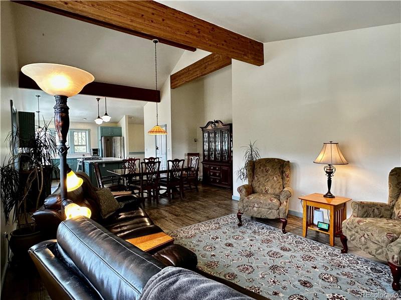 Reverse view of living room, dining room and kitchen