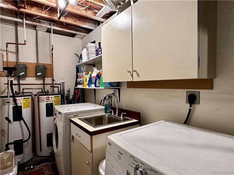 Laundry area, showing dual water heaters