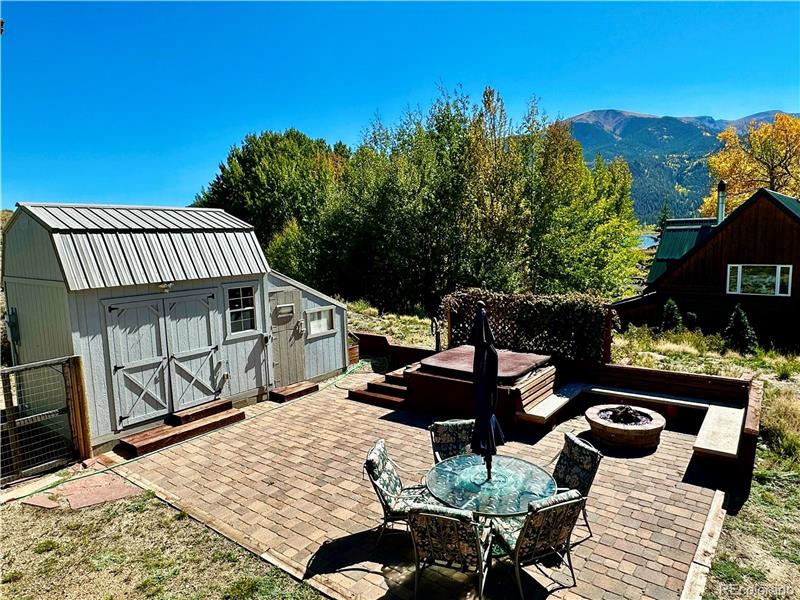 View from deck of patio, shed and greenhouse