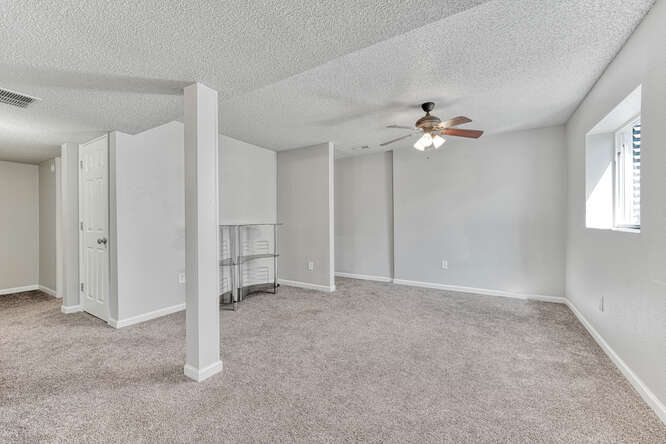 Basement Family Room w/ Neutral Carpet