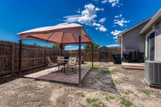 Backyard Covered Paver Patio for Outdoor Dining & Relaxation