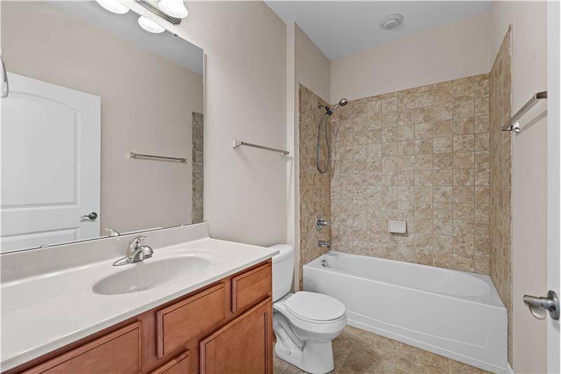 Second bathroom features second bathroom features tile floor, tile tub/shower surround