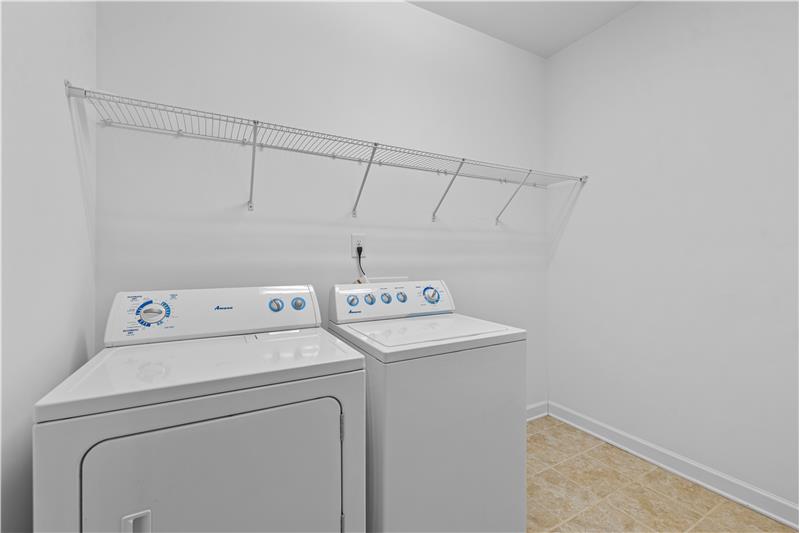Spacious laundry room; washer & dryer convey