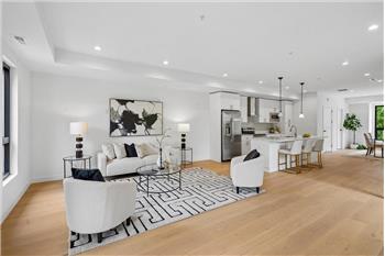 Spacious living room that opens directly into the kitchen, perfect for entertaining.
