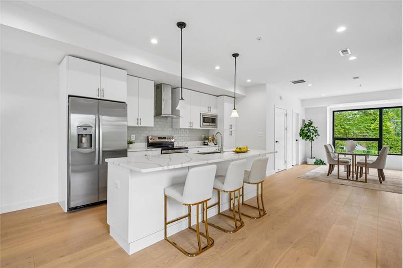 Gourmet kitchen with high-end appliances, custom cabinetry, and premium stone countertops.