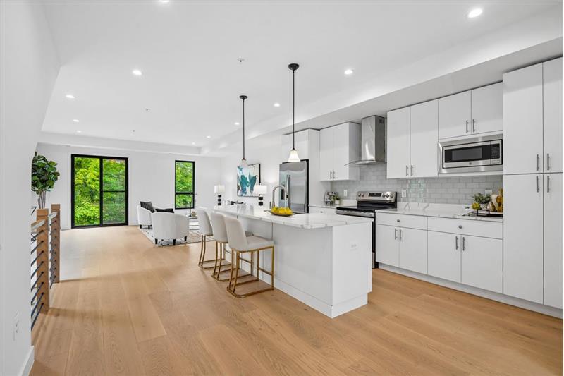 Modern kitchen featuring a convenient breakfast bar area.