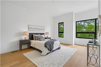 Spacious primary bedroom featuring a private ensuite bathroom.