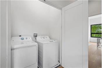 Convenient top-floor laundry room for added ease and accessibility.